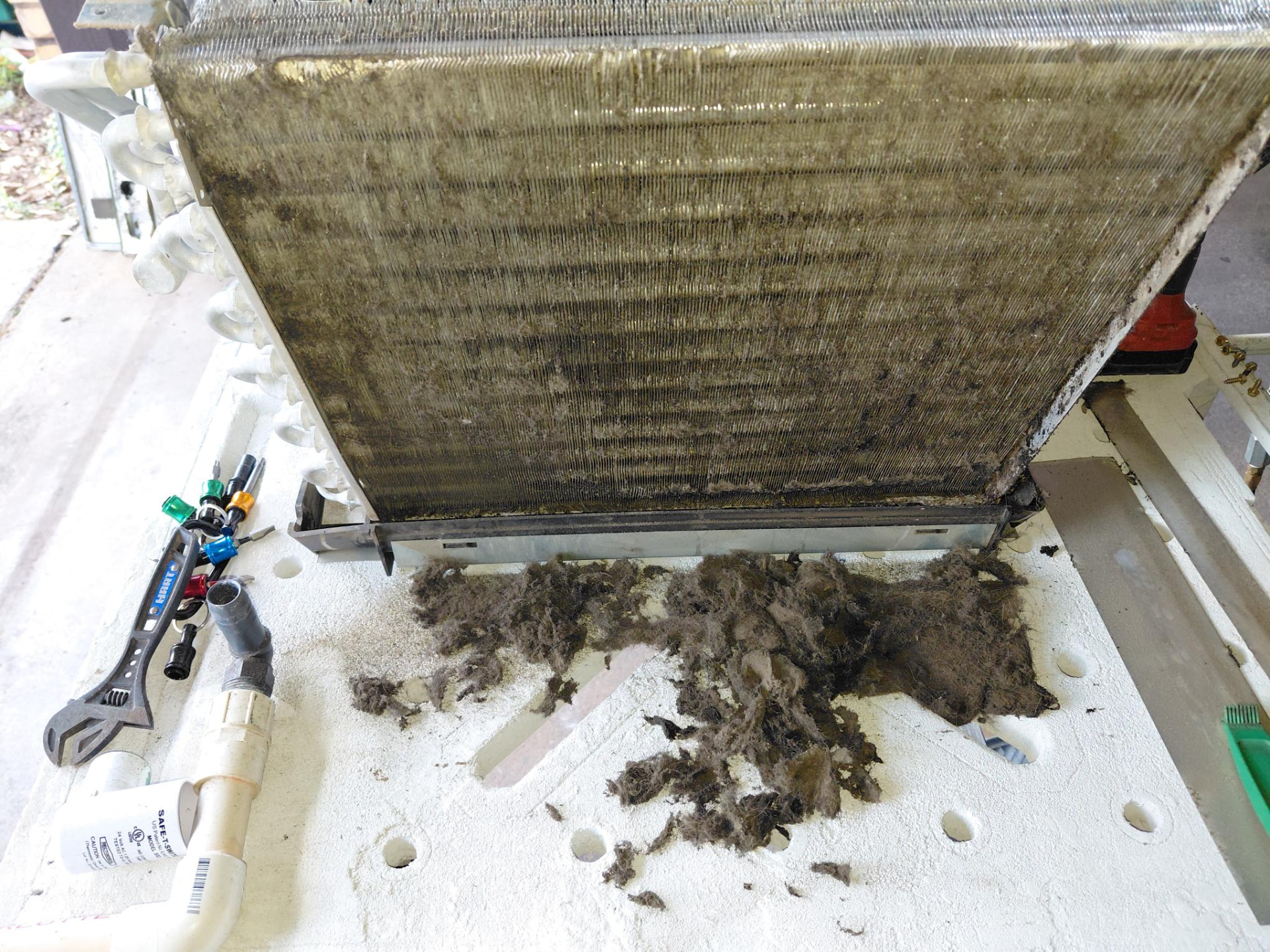 HVAC coil and removed debris documented during service.