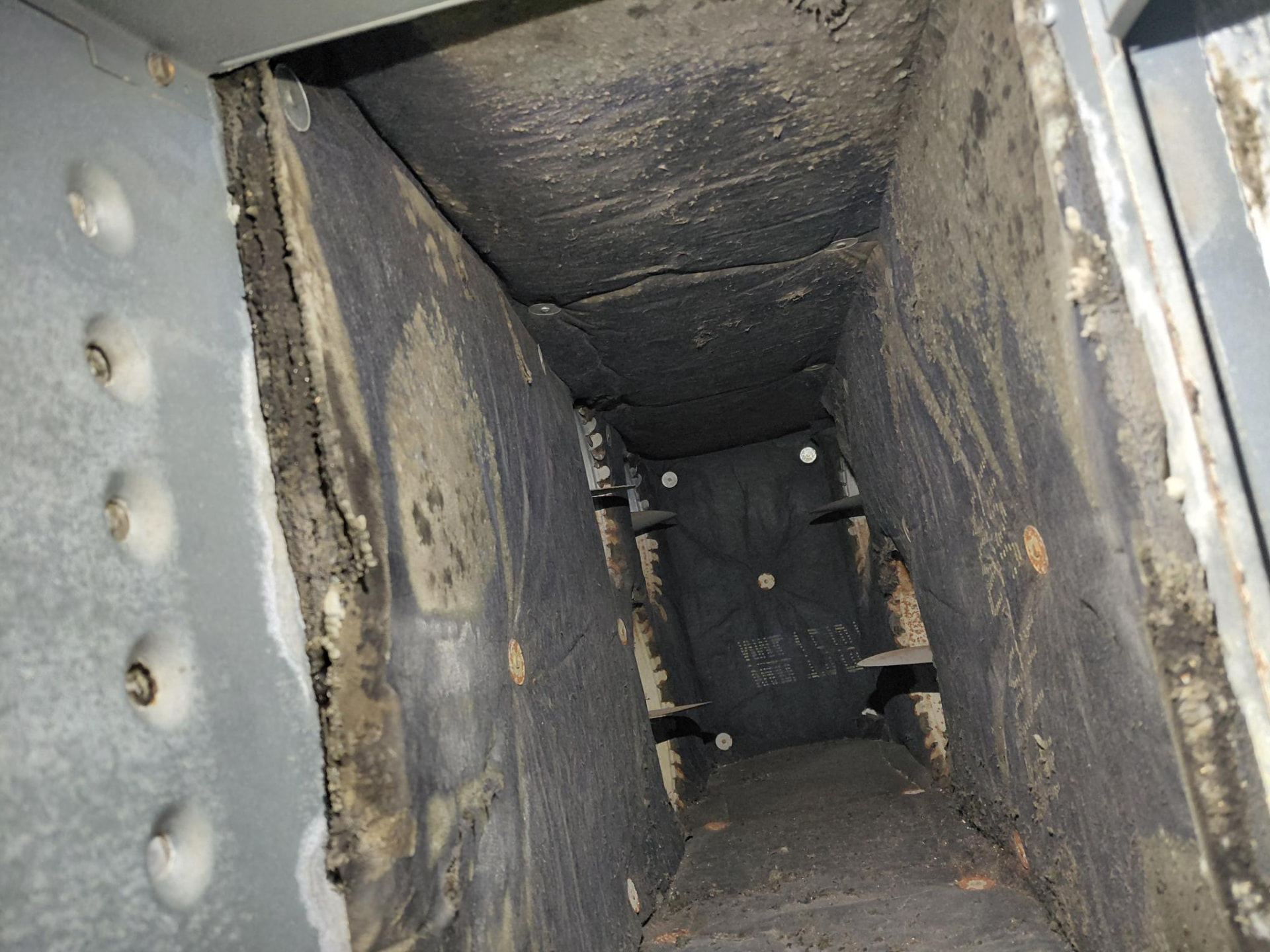 Inside a duct section during an EnviroClean service visit.