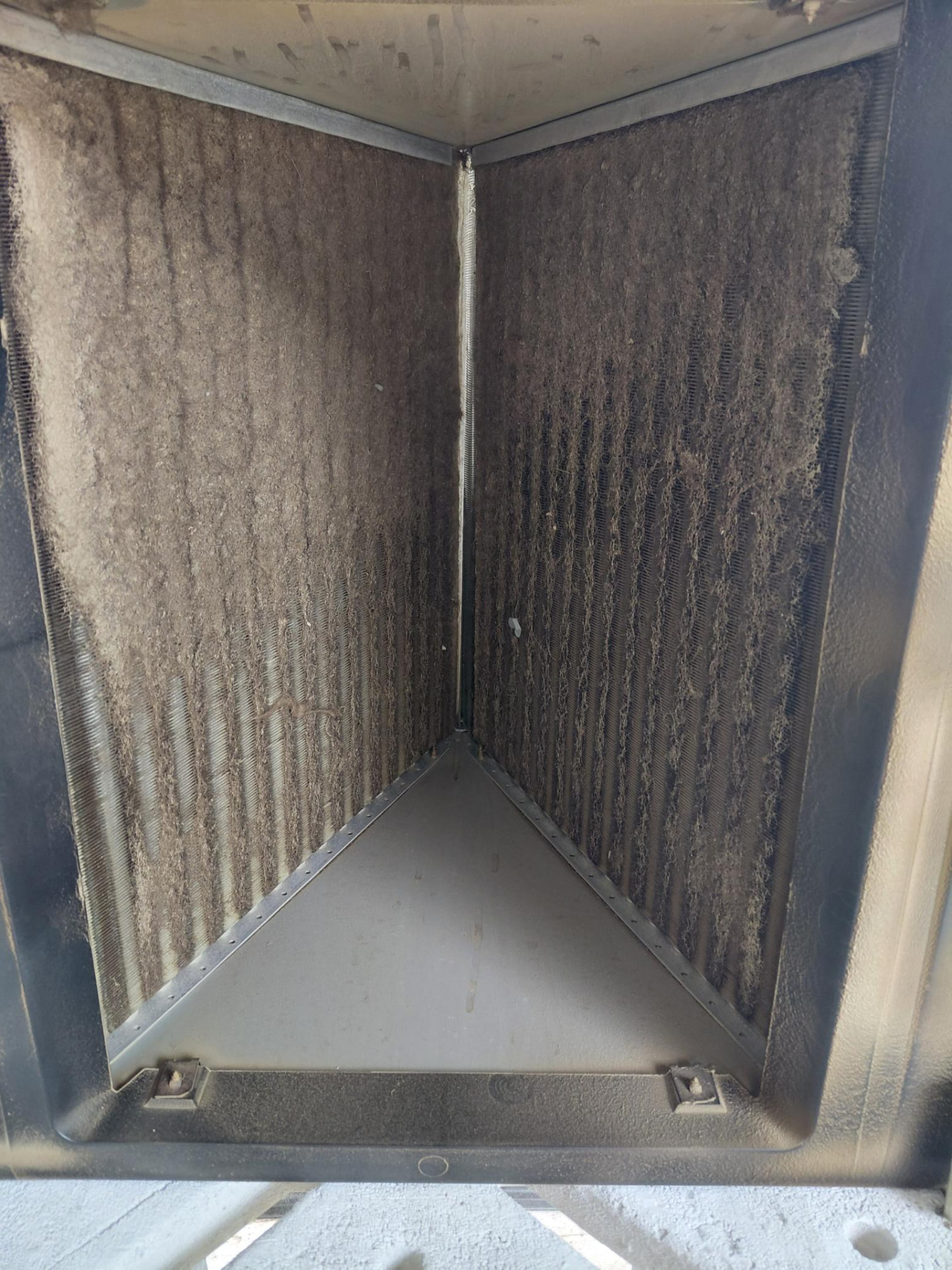 HVAC coil with visible buildup before cleaning.